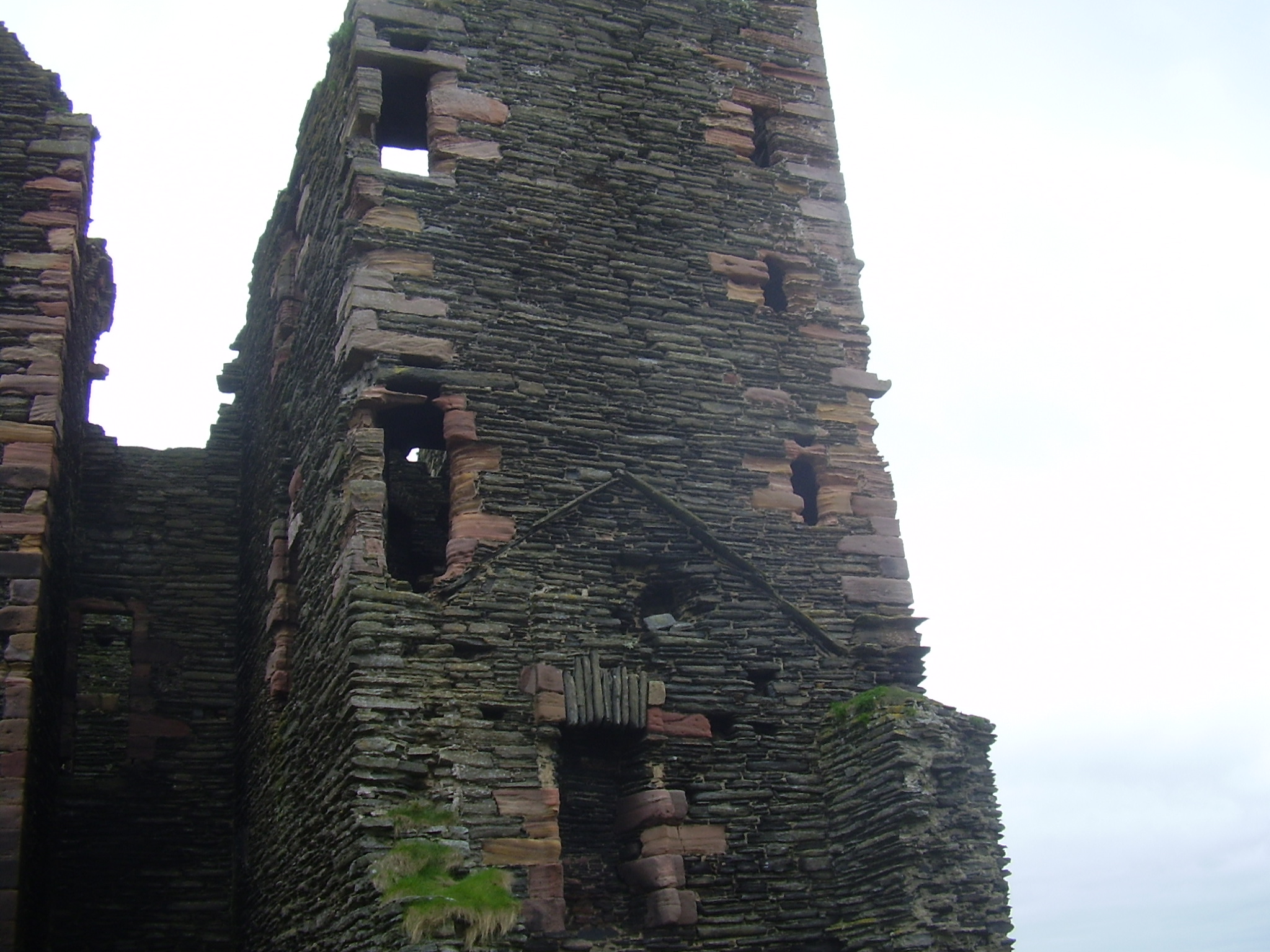 Peaked roof with newer superstructure