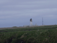 [Noss Head Lighthouse from Castle Sinclair Girnigoe]